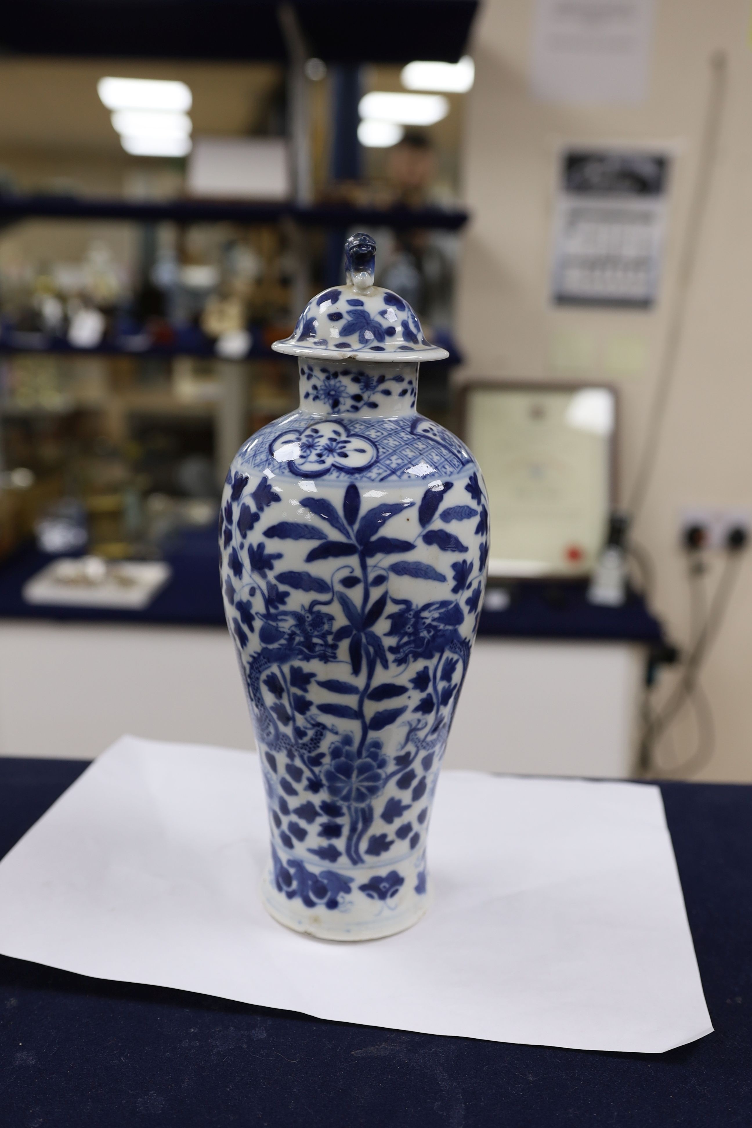 A pair of Chinese blue and white dragon vases and covers, circa 1900. 28cm